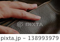 Hand Touching Textured Leather Surface Close Up 138993979