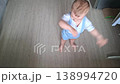 Adorable toddler boy dancing happily indoors 138994720