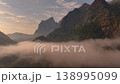 Morning mist at sunrise in Nong Khiaw, Laos. Dawn Clouds beyond Mountain Peaks, Sunrise Aerial Drone Shot. 138995099