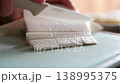Cheese cutting board sheep goat white cheese festive table closeup slicing assortment 138995375