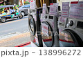 Thailand street laundromat washing machines storefront urban daily life transportation scene 138996272