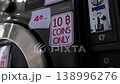 Thailand laundromat coin operated washing machine payment slot close up detail 138996276