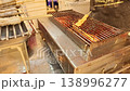 Thailand street food crocodile skewers grilling barbecue exotic meat market scene 138996277