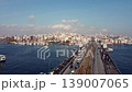 Urban Bridge with Traffic Connecting Coastal City Districts 139007065