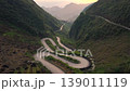 Aerial View Of the Winding Tham Ma Mountain Pass In Ha Giang Province In Vietnam - Ha Giang Loop Drone Shot at Sunset. 139011119