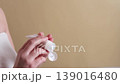Woman squeezing cosmetic cream from tube onto hand, skincare routine and moisturizing body care concept 139016480