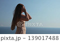 Woman hair sea, enjoying freedom and natural beauty outdoors 139017488