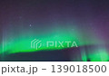 Aurora borealis in the night northern sky. Ionization of air particles in the upper atmosphere. 139018500
