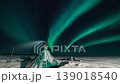 Aurora borealis in the night northern sky. Ionization of air particles in the upper atmosphere. 139018540