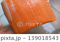 Salting salmon, Pieces of red salmon fish fillet. Red fish salinizing a piece of salmon. 139018543