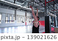 An athletic man practices at a ninja club's indoor obstacle course. 139021626