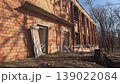 Abandoned Brick Building In Winter Woods, Vacant Doorways, Shadowed Facade, Leaflittered Ground, Late Afternoon Sunlight Casting Long Shadows, Exposed Masonry And Plaster, Empty Hallways 139022084