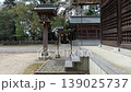 A tranquil scene in the shrine grounds, with votive tablets swaying in the breeze. 139025737