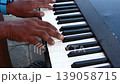 human hand playing Electric piano 139058715
