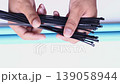 hand locking cable tie on isolated 139058944