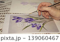 Student comparing their drawing with a reference, learning botanical illustration. 139060467