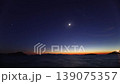 Beautiful Timelapse of New Moon Setting over Aegean Coastal Islands and Glittering Stars in Evening 139075357