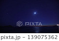Beautiful Timelapse of New Moon Setting over Aegean Coastal Islands and Glittering Stars in Evening 139075362
