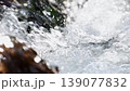 Horizontal super close-up real-time video of fast-moving mountain river flow with clear water in 4K resolution, side view. Current falling creating air bubbles. With sound of waterfall splashing noise 139077832
