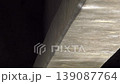 The shimmering light reflecting off the concrete pillars beneath the bridge on the water's surface. Background material: Fixed. Live-action. 4K. 139087764