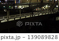 Japan, Tokyo, Ikebukuro Station West Exit area, night view, crossing overpass and train on tracks (time lapse photography) 139089828