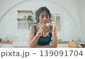 Holiday concept of 4k Resolution. Asian woman drinking morning coffee in the kitchen. 139091704