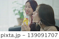 Holiday concept of 4k Resolution. Asian women blowing soap bubbles together inside home. 139091707