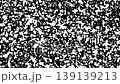 A black and white speckled pattern shifts and changes under bright daylight. The light creates interesting shapes and contrasts throughout the pattern. 139139213