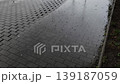 Raindrops falling on a wet pavement sidewalk 139187059