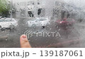 Hand writing the word spring on a foggy window during rain 139187061