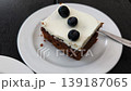 People eating blueberry carrot cake and apple crumble dessert 139187065