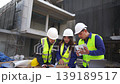 Construction project meeting building site team collaboration urban environment close-up view project management concepts 139189517