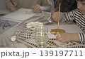 Little child painting with golden paint on paper, concept of kids creativity and art education. 139197711