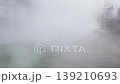 White steam rising from the hot spring 139210693