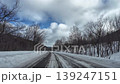 POV Driving on Snowy Winter Road with Snow Fence and Forest in Furano Hokkaido Japan 139247151