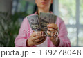 Woman counting US Dollar bills, close-up. Concept of investment and success 139278048