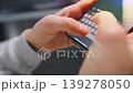 Female hands typing text on smartphone close-up. 139278050
