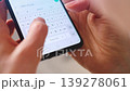 Female hands typing text on smartphone close-up. 139278061