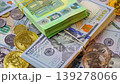 Background with US Dollar and Euro bills, BTC bitcoins rotating 139278066