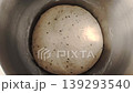 Bread dough with caraway seeds rising in a metal bowl. 139293540