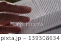 Close-up, a woman's hand turning a page of a book while reading 139308634