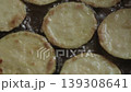 Zucchini, cut into rings, fried in oil in a pan 139308641