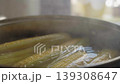 Close-up of corn cobs boiling in pot on kitchen stove 139308647