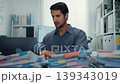 Stressed young Latin businessman having heart attack with severe chest pain at office desk. Cardiac arrest emergency, overworked burnout, medical stroke, work problem, health insurance crisis concept. 139343019
