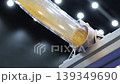 Close up of yellow granular plastic material moving through transparent industrial tubes in a modern processing system. Plastic manufacturing automation engineering and production technology concept. 139349690