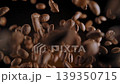 Coffee espresso beans exploding and falling in cinematic slow motion isolated on a dark background creating a highly engaging visual asset perfect for high end cafe marketing campaigns 139350715