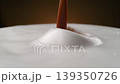 coffee droplet impacts the surface of hot espresso foam in extreme detail close up creating a dynamic splash perfect for high quality food advertising and rich morning drink visuals 139350726