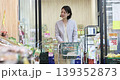 Housewife shopping at a supermarket 139352873