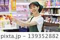 Woman stocking shelves 139352882