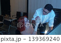 Programmers working at night analyzing code on monitors in a modern office. Software developers collaborating on debugging cybersecurity and data programming projects. Ai coding Software technician. 139369240